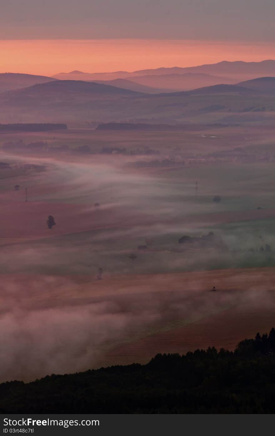 European countryside during the coming misty sunrise.