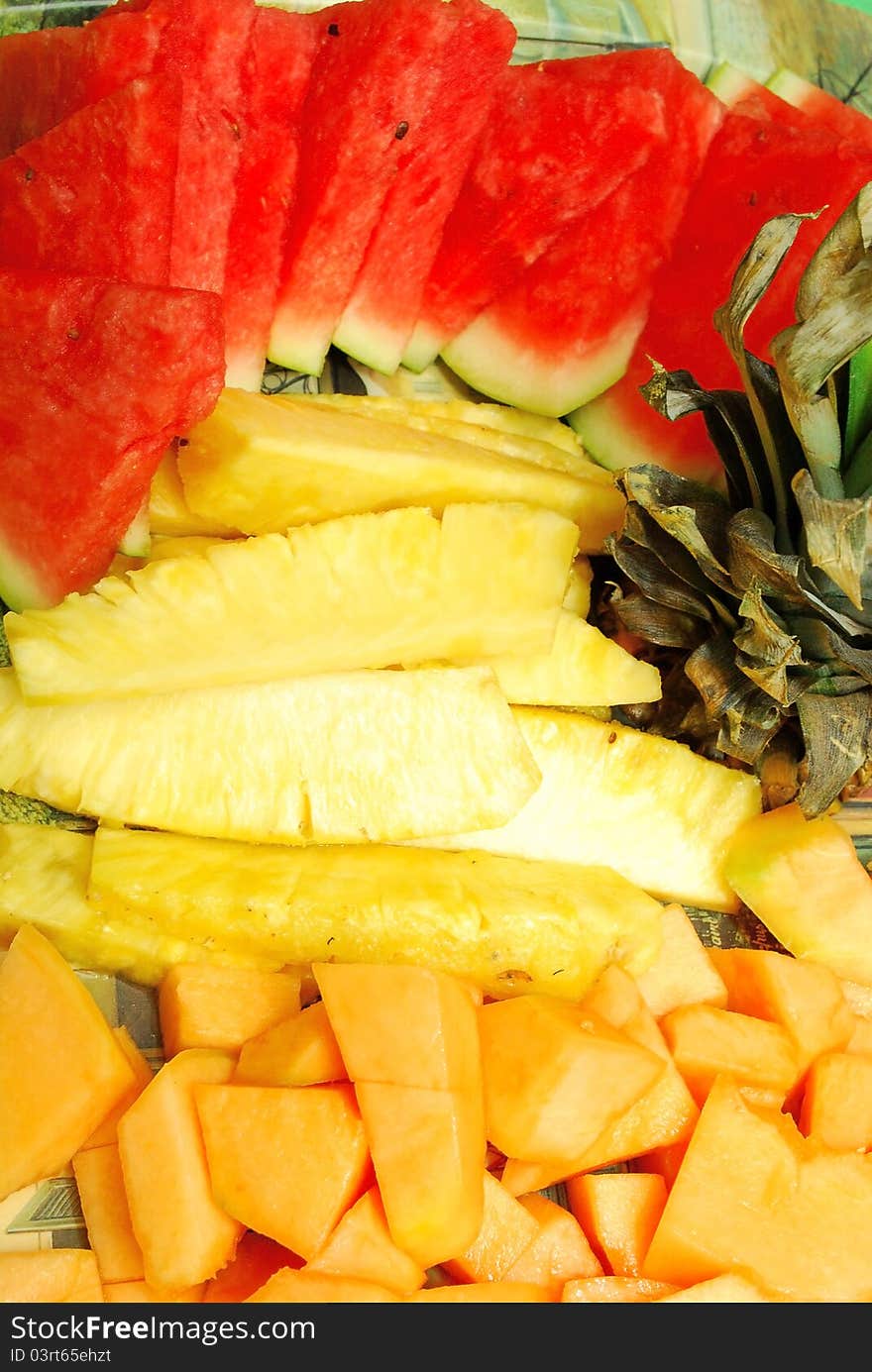 Closeup of Fruit Plate with watermelon, melon, pineapple on Hawaii party.