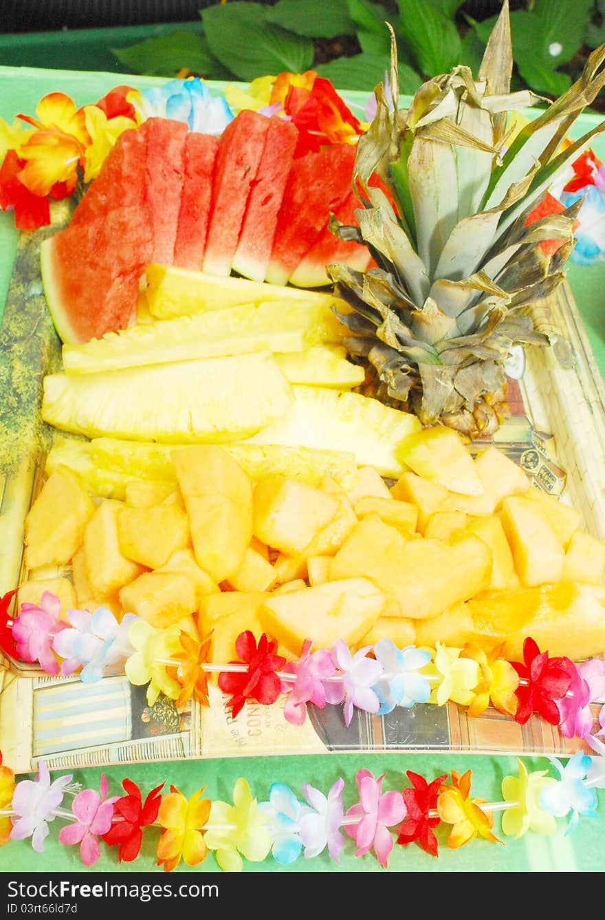 Closeup of Fruit Plate with watermelon, melon, pineapple on Hawaii party.