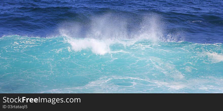 A wave in the moment of mounting - in its natural aqua colors. A wave in the moment of mounting - in its natural aqua colors