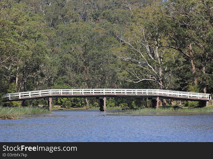 Old Wooden Bridge Over River In Australian Forest