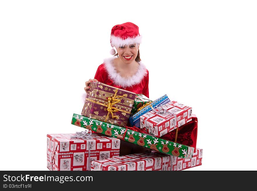 Santa Claus is sitting in front of lots of gifts. Santa Claus is sitting in front of lots of gifts