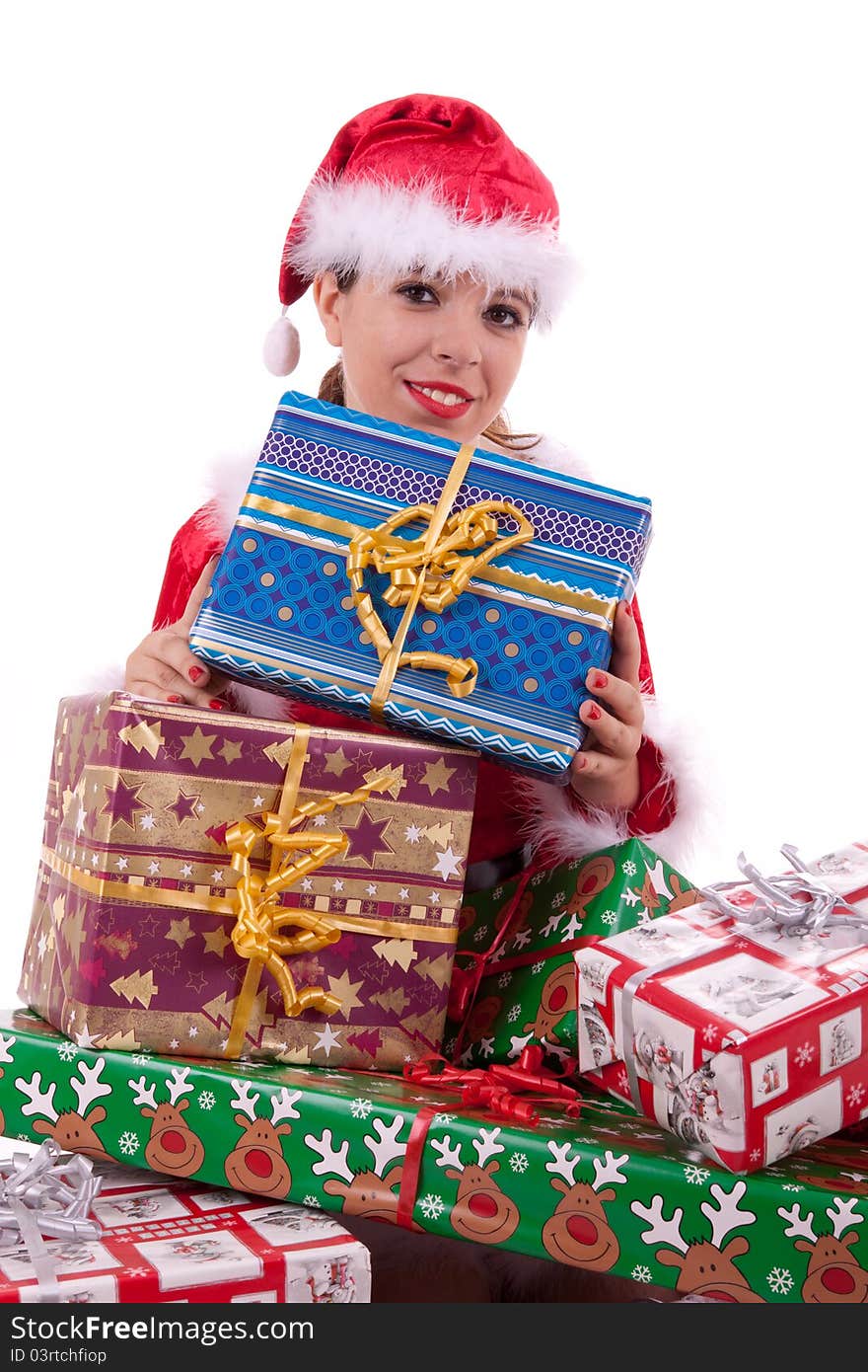 Santa Claus is sitting in front of lots of gifts. Santa Claus is sitting in front of lots of gifts