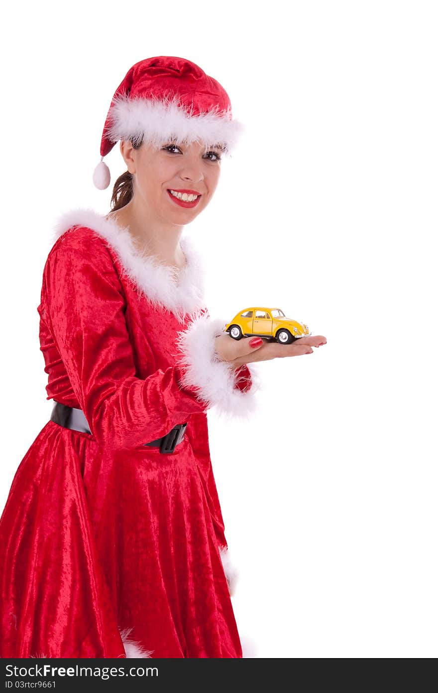 The young Santa Claus is holding a car in her hand. The young Santa Claus is holding a car in her hand