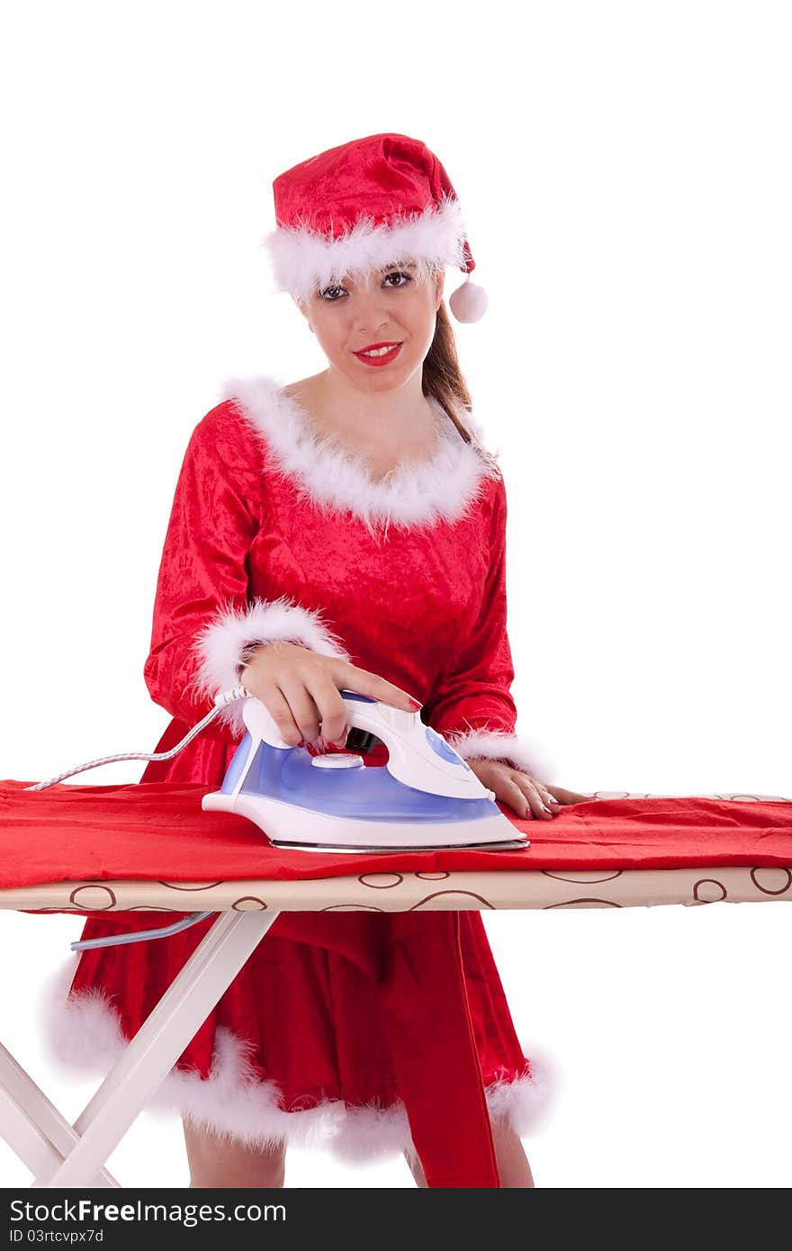 Young Santa Claus is ironing a suit. Young Santa Claus is ironing a suit