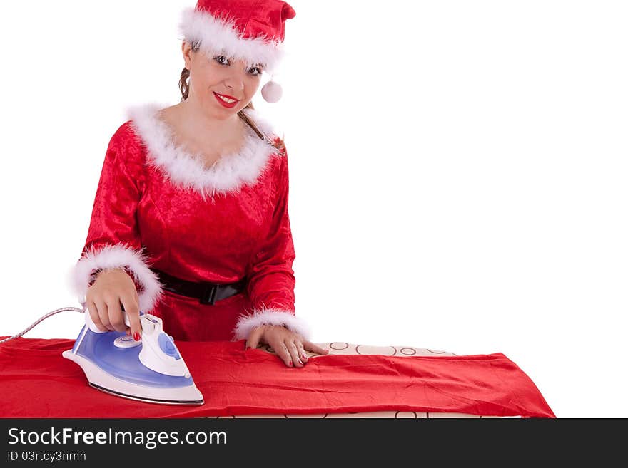 Young Santa Claus is ironing a suit. Young Santa Claus is ironing a suit