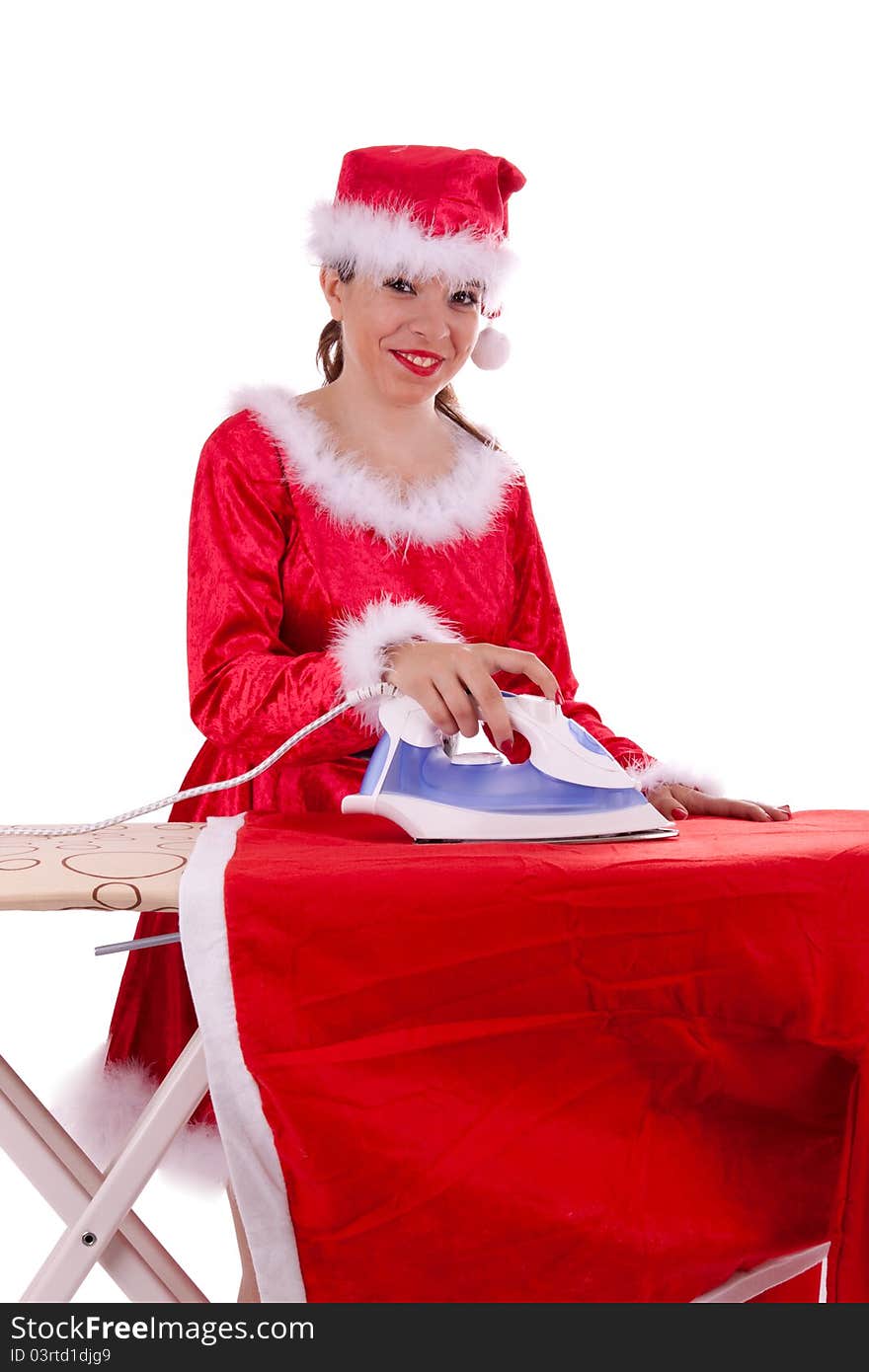 Young Santa Claus is ironing a suit. Young Santa Claus is ironing a suit