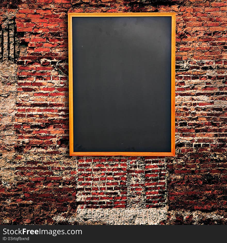 Blank Blackboard on Old brick wall for background. Blank Blackboard on Old brick wall for background