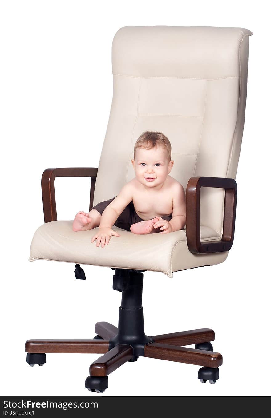 Baby boss sits in office chair on white