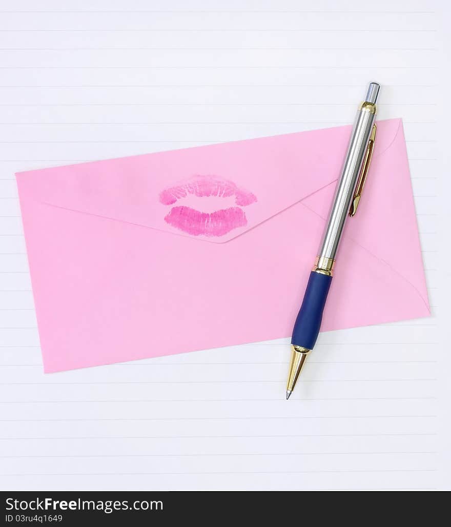 Pink envelope with a pen