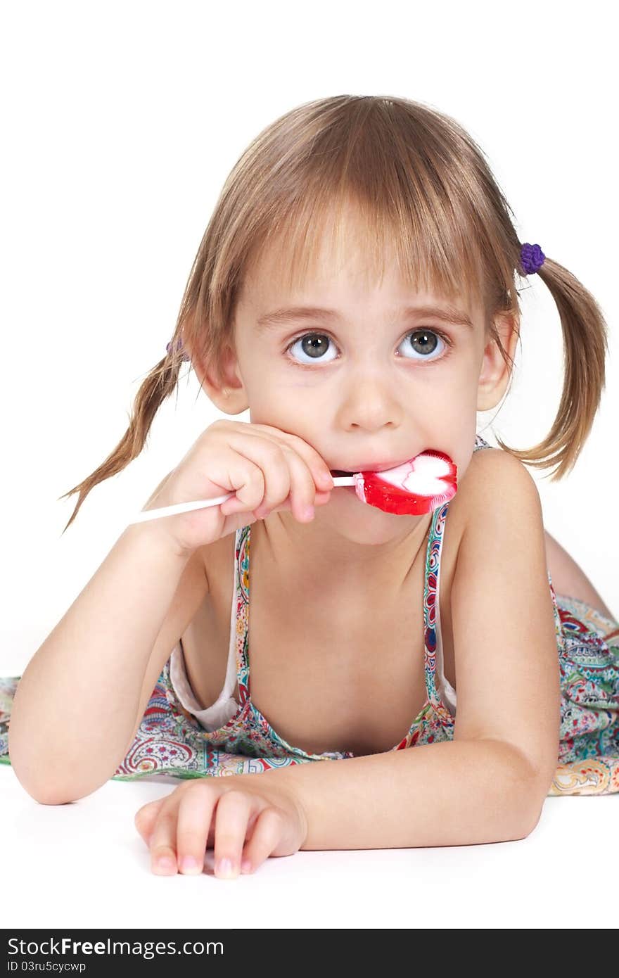 Little Girl Biting Red Heart-shaped Lollipop