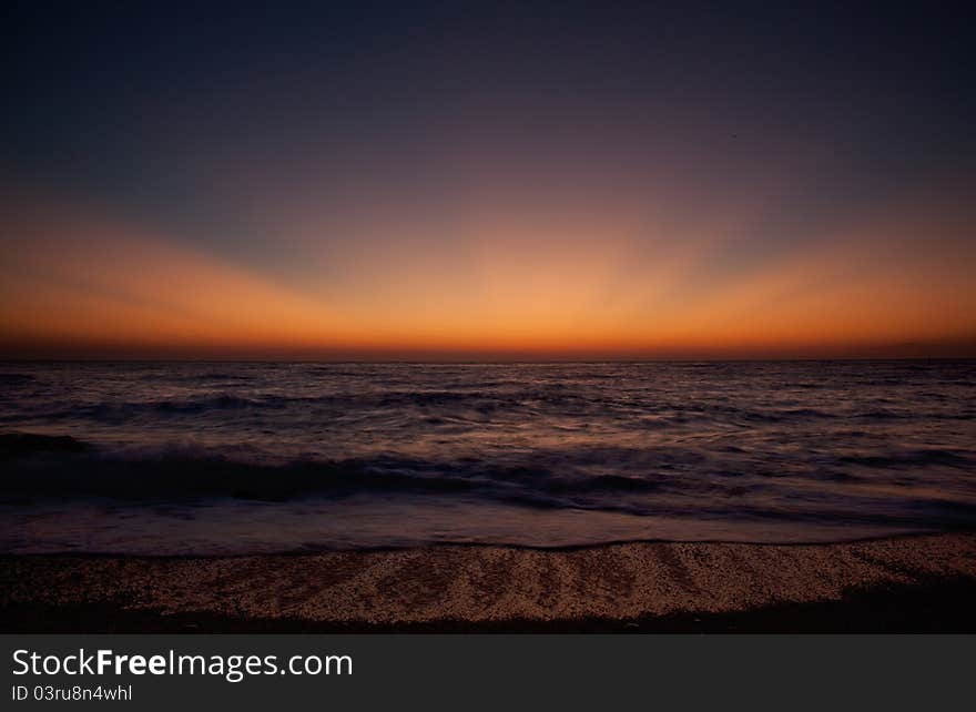 Sunset on the Egremni beach Greece long exposed image. Sunset on the Egremni beach Greece long exposed image