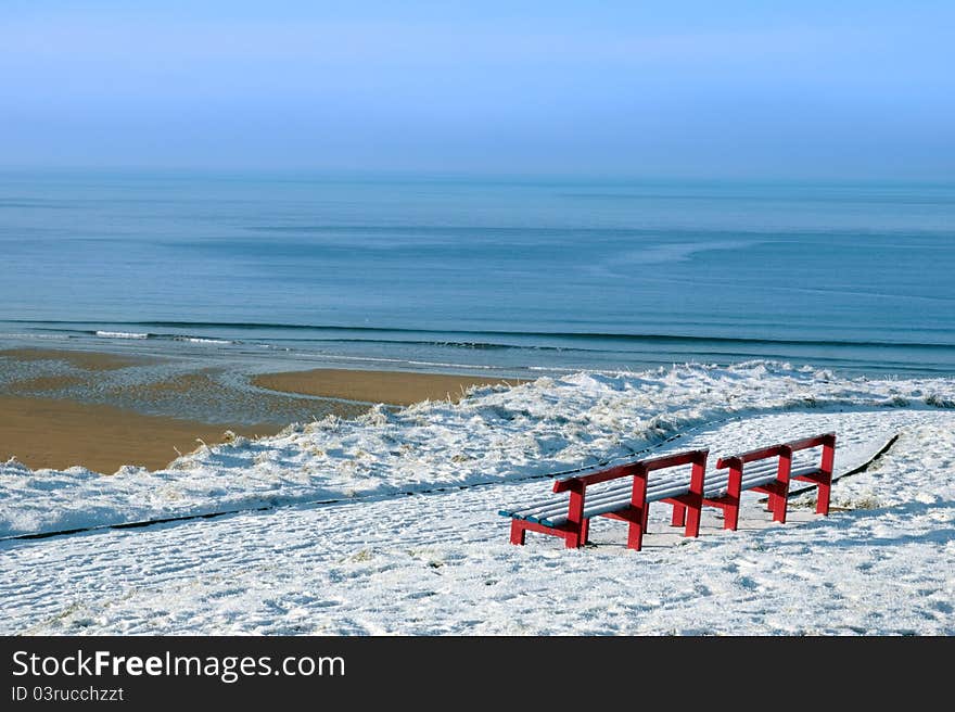 Atlantic winter view and red benches