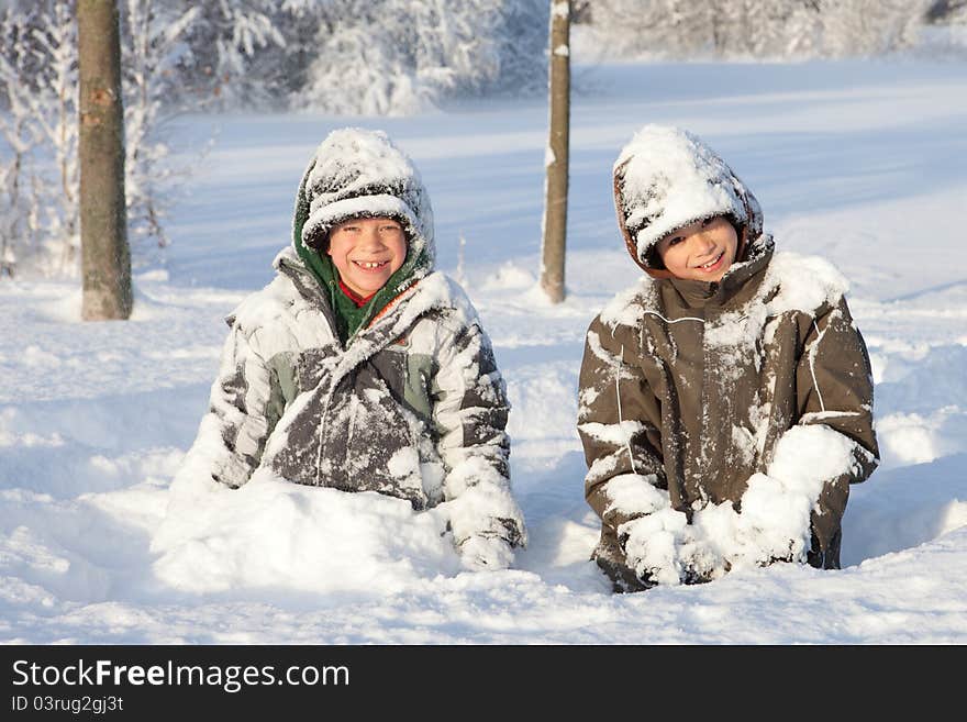 Happy boys in snow