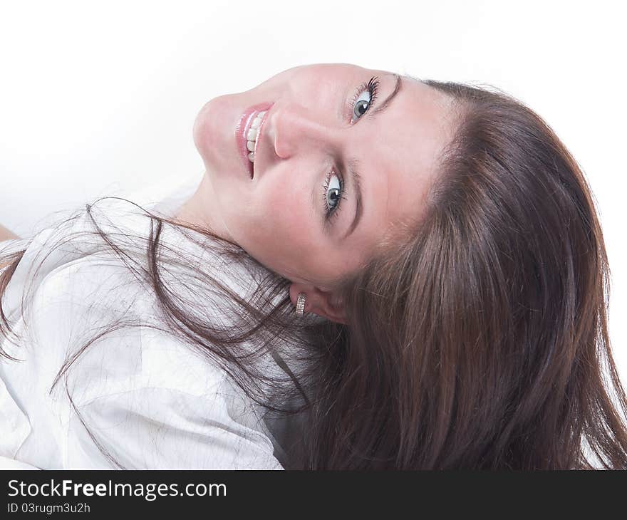 Beautiful girl lying on the snowy bed