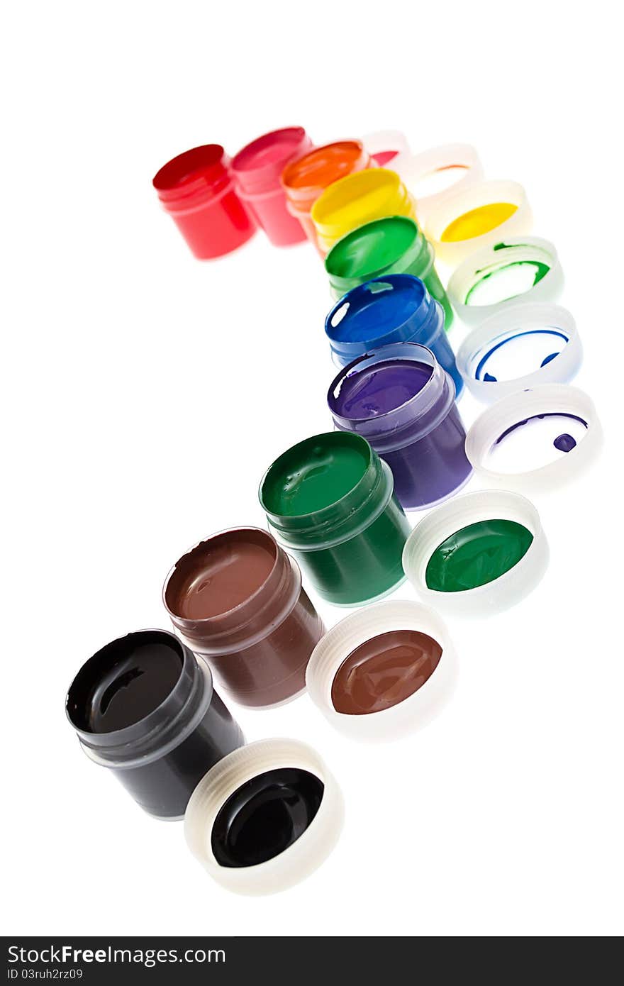 Multi-colored gouache paint isolated on a white background