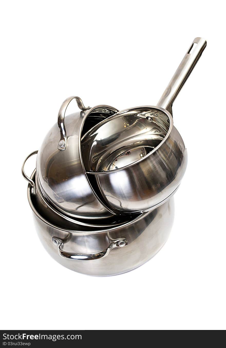 Shiny metal pans isolated on a white background