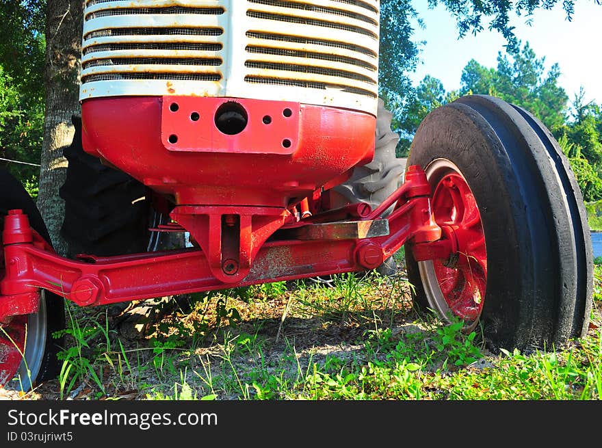 Old tractor setting in field