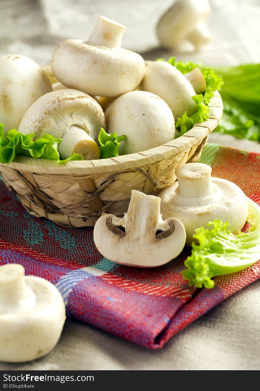 Fresh white champignons in a basket. Fresh white champignons in a basket