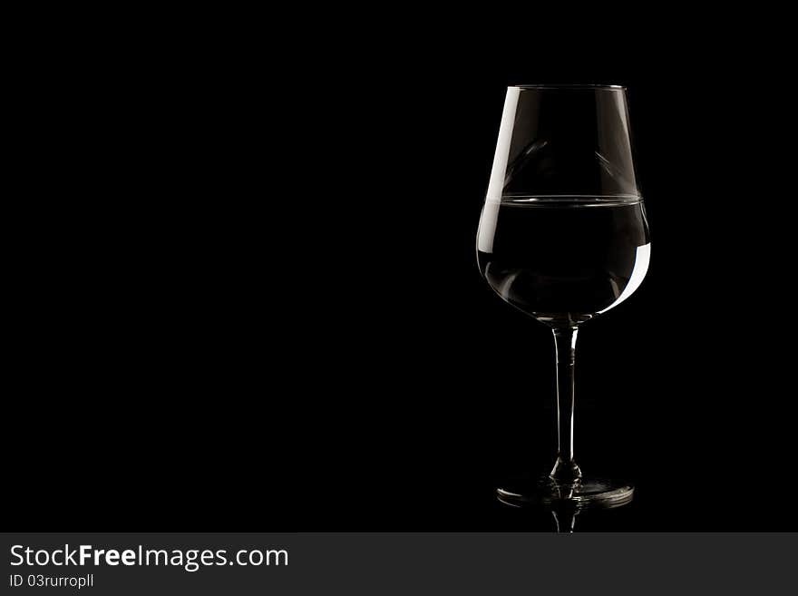 Photo of highlighted wine glass edges on black background