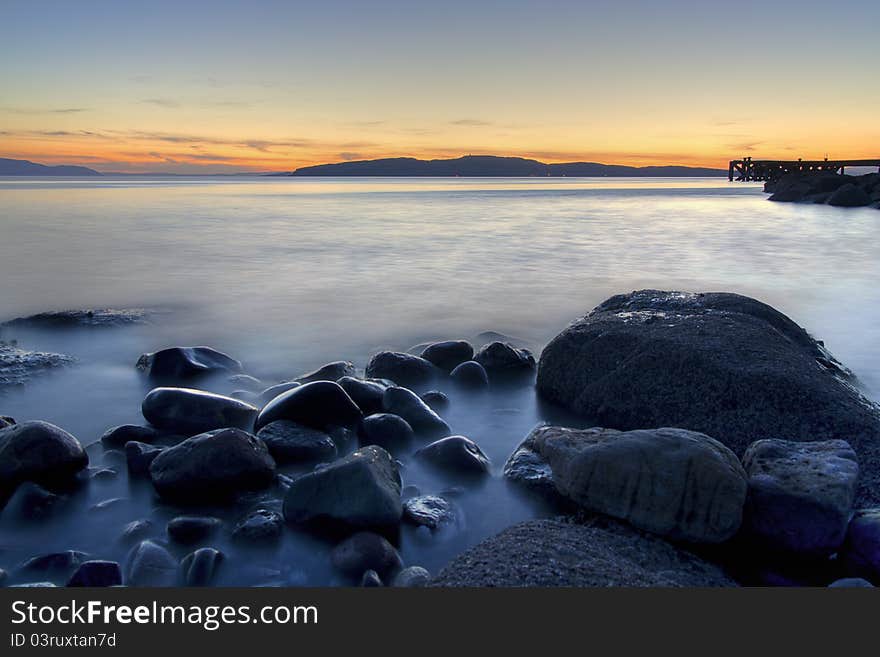 Sunset in ayrshire scotland looking towards the isle of bute. Sunset in ayrshire scotland looking towards the isle of bute.