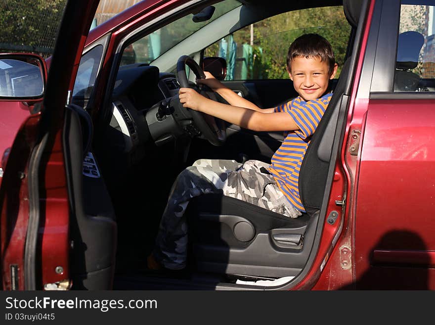 Little boy driver in car