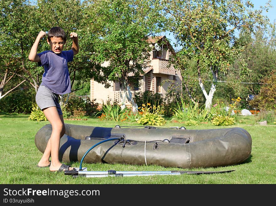 Boy inflate boat