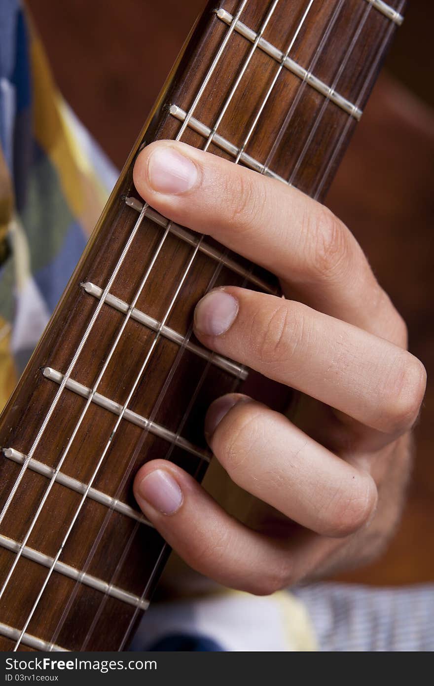 Really great shot capturing detail of a guitarist