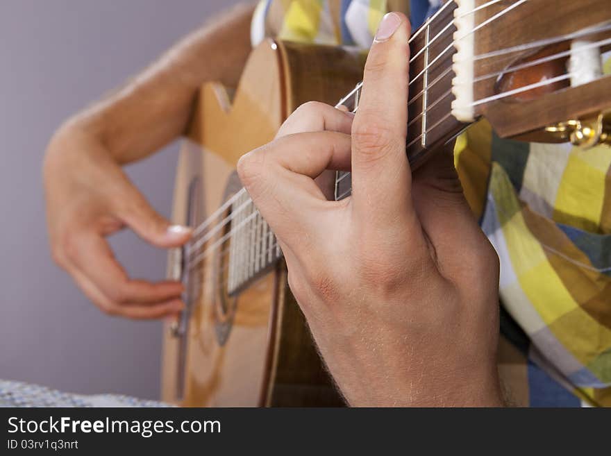 Really great shot capturing detail of a guitarist