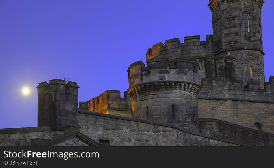 Castle with towers in moonlight