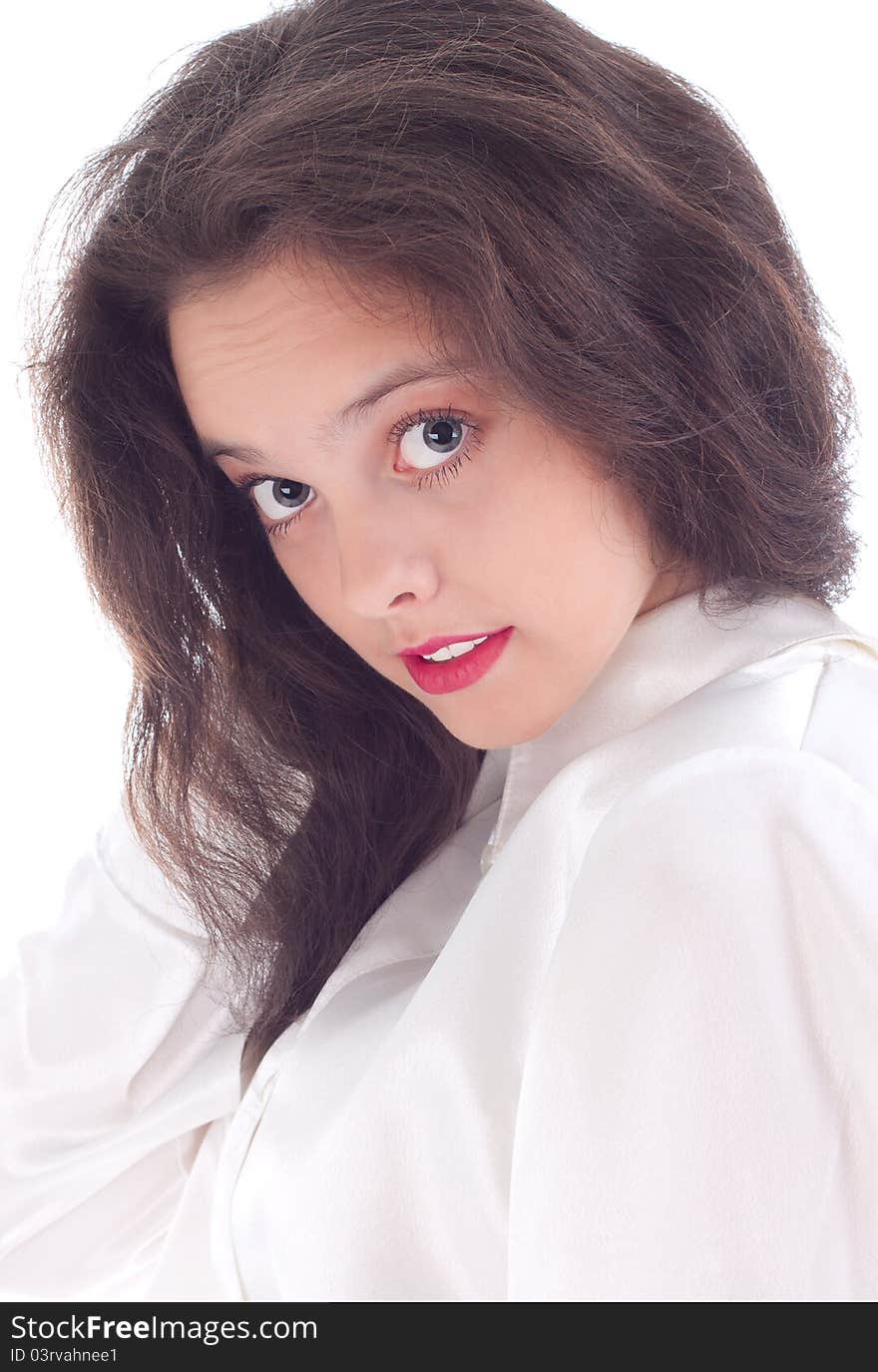 Beautiful young woman with surprise stares at a white background