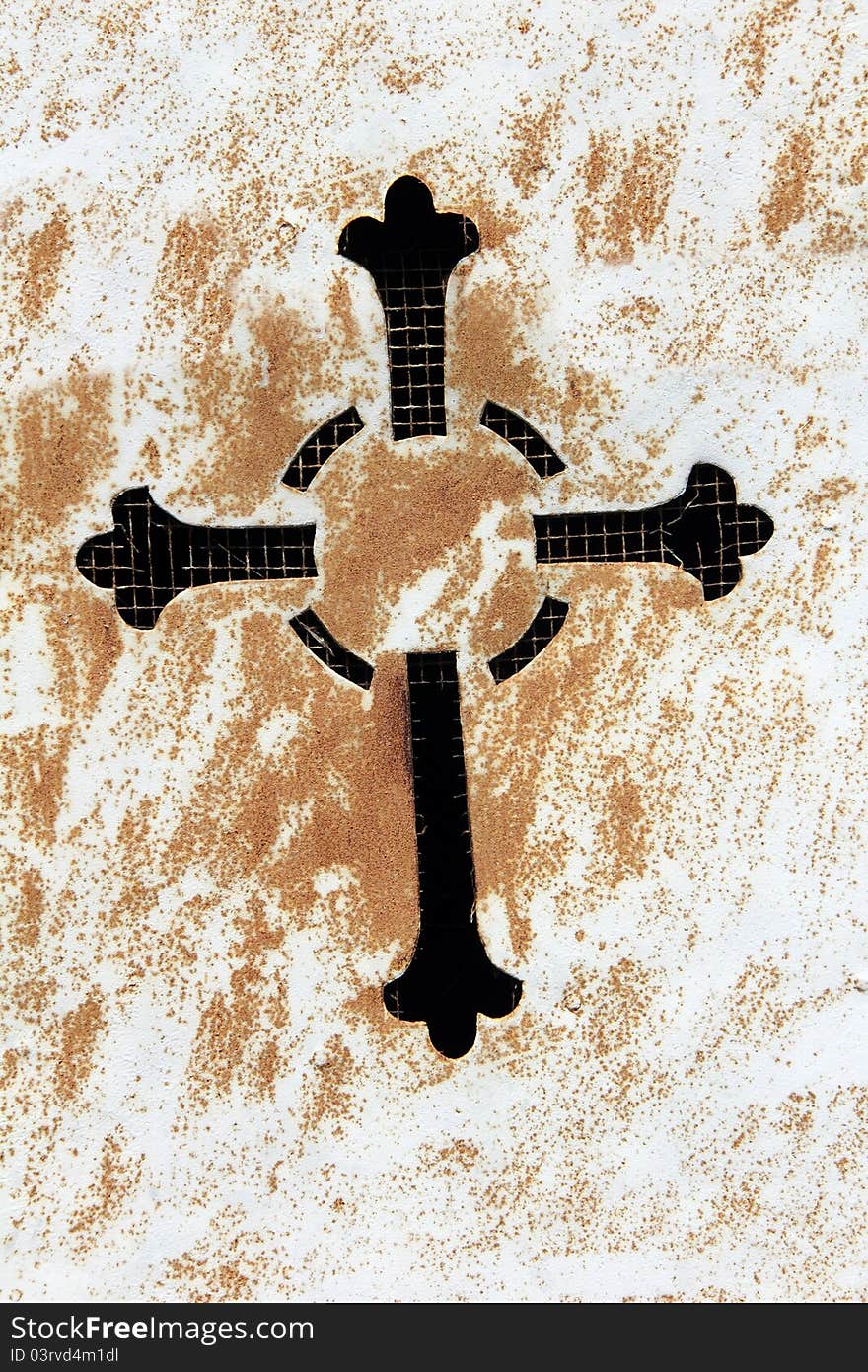 Old religious metal cross in retro look