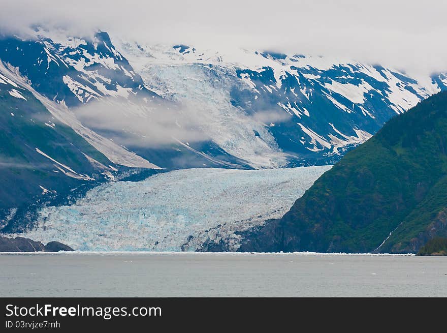 Majestic fjord reaching down from the mountains into the sea.