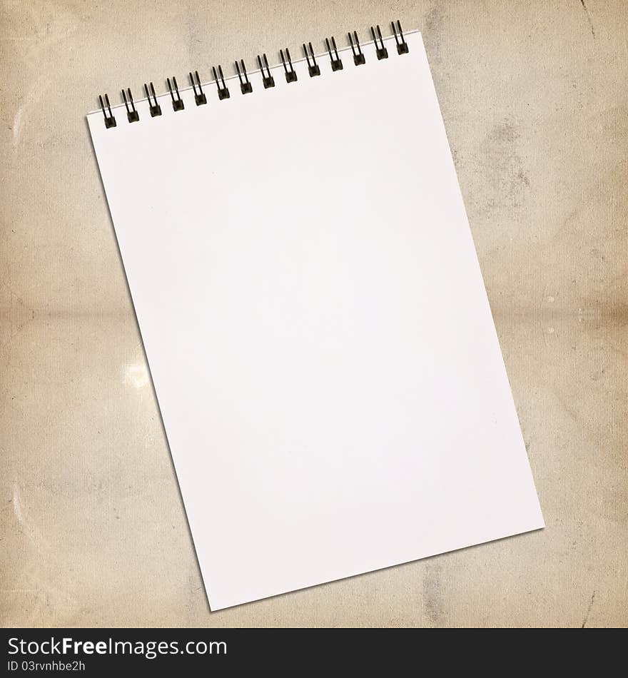 White notebook for painting on vintage background