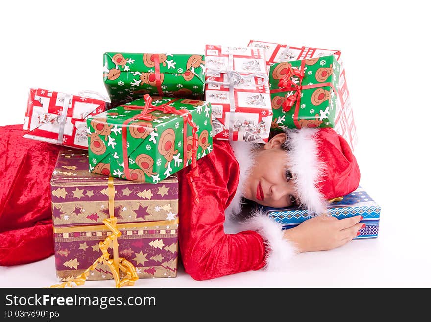 Santa Claus is lying on the floor and buried with gifts. Santa Claus is lying on the floor and buried with gifts