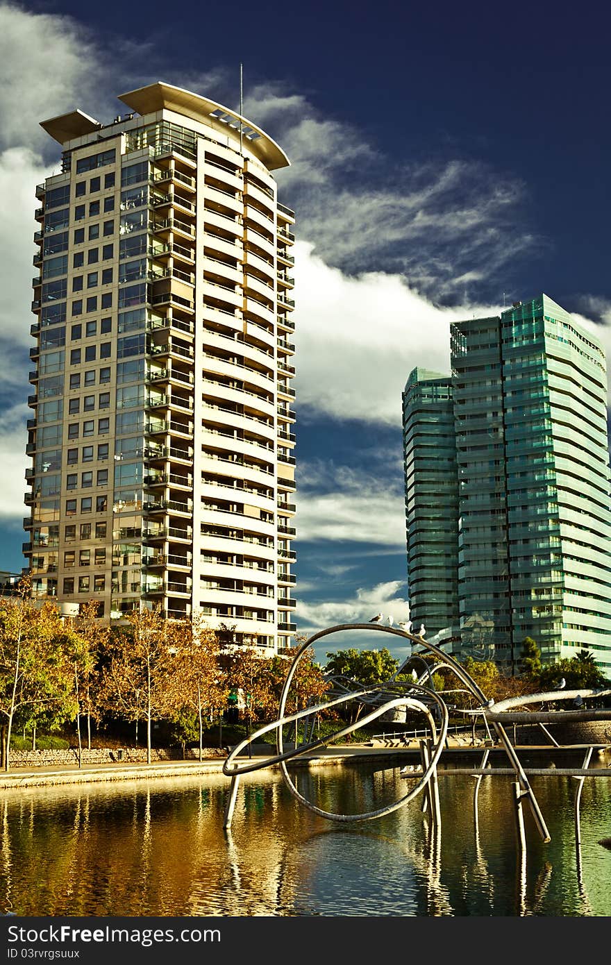 Two high-rise buildings on the lake shore. Two high-rise buildings on the lake shore