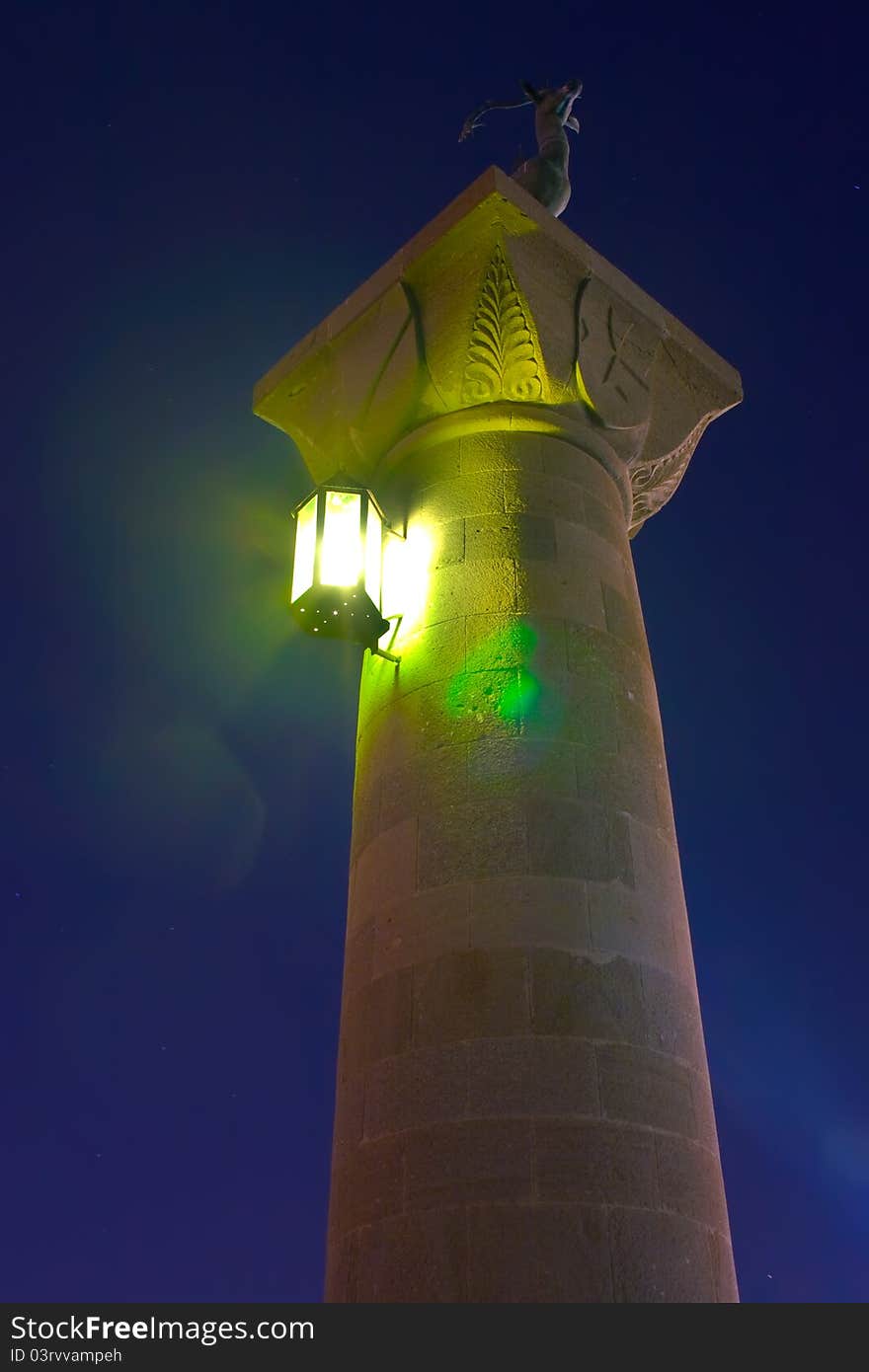 Column with a statue of a deer on top in Rhodes harbour Mandraki. Column with a statue of a deer on top in Rhodes harbour Mandraki