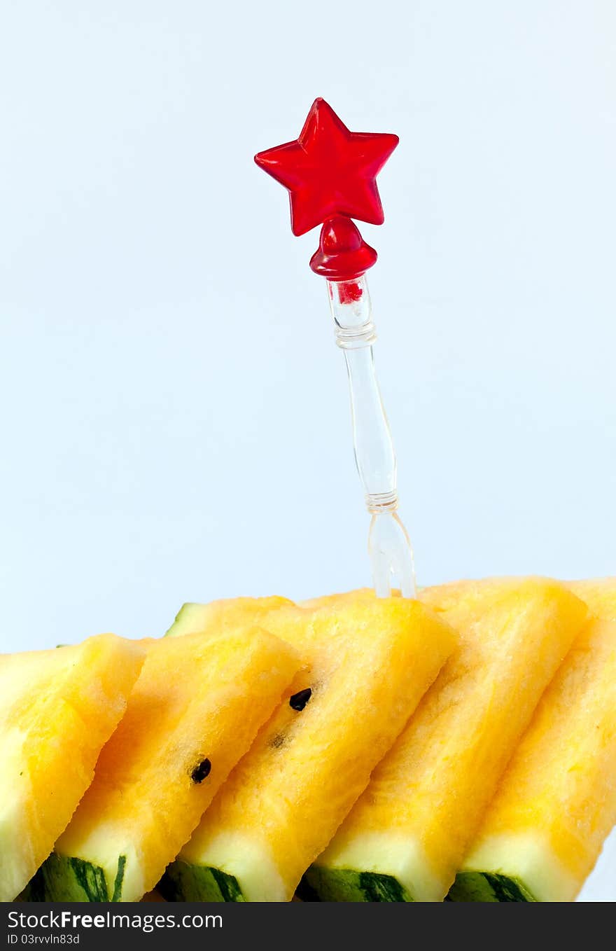 Slice yellow watermelon on blue background