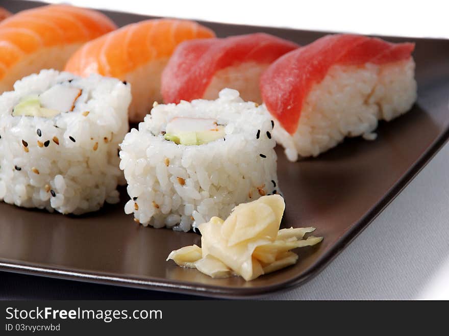 Sushi on a brown dish