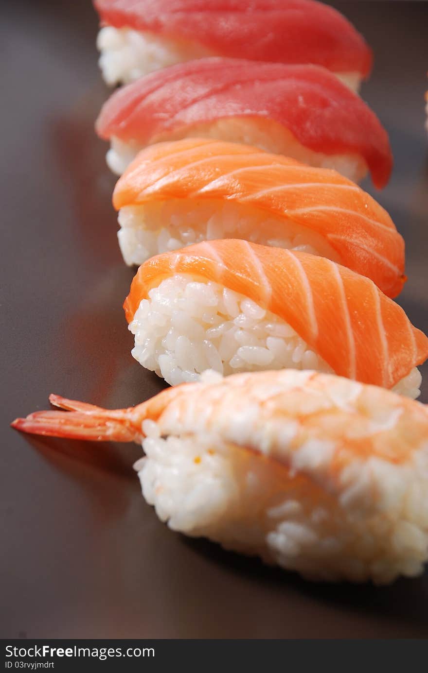 Sushi on a brown dish