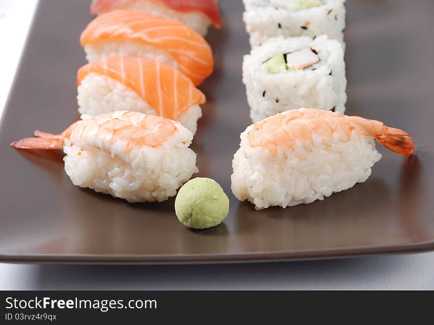 Sushi on a brown dish