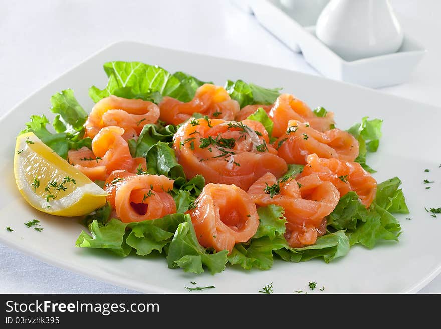 Close up view of nice fresh salad on white back. Close up view of nice fresh salad on white back