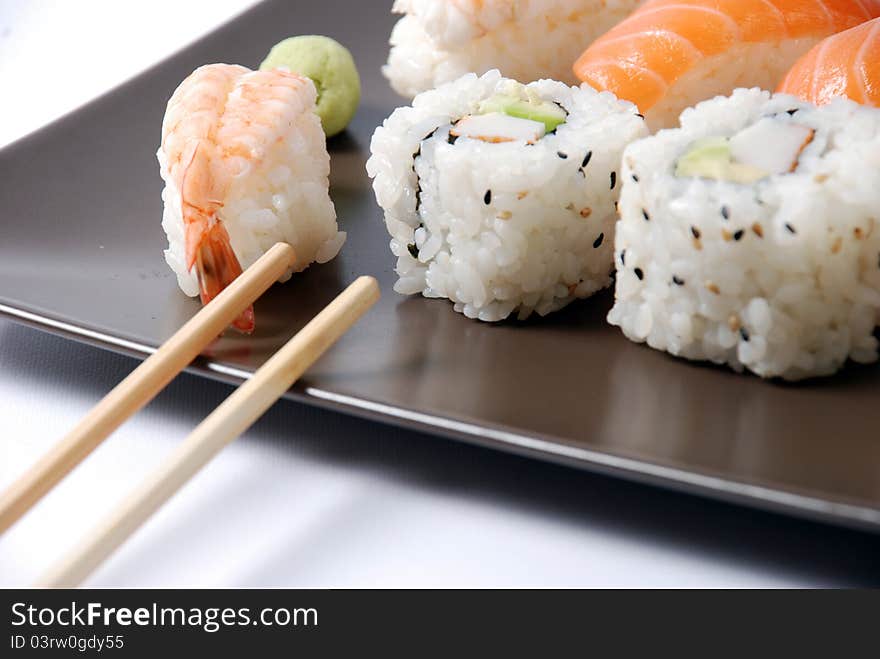 Sushi on a brown dish