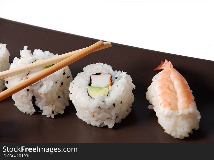 Sushi on a brown dish