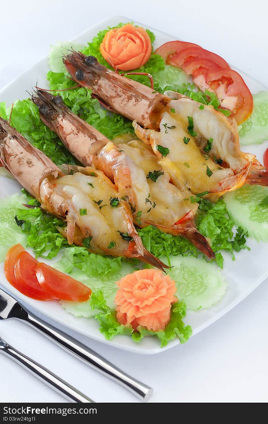 Close up view of nice fresh shrimps with vegetables on white back. Close up view of nice fresh shrimps with vegetables on white back