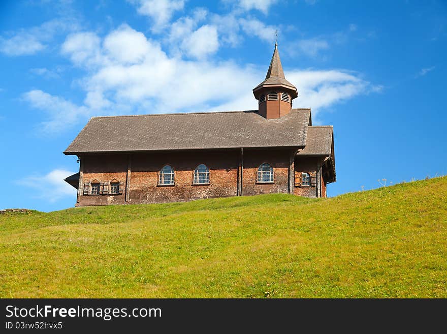 Small wooden church in swiss alps