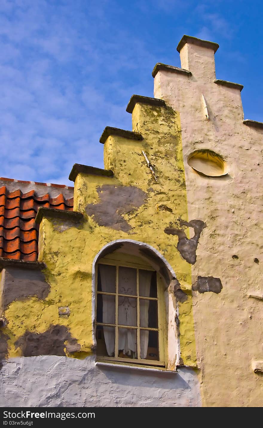 Fragment of a classical dwelling house in Bruges. Belgium. Summer urban landscape. Dutch culture.