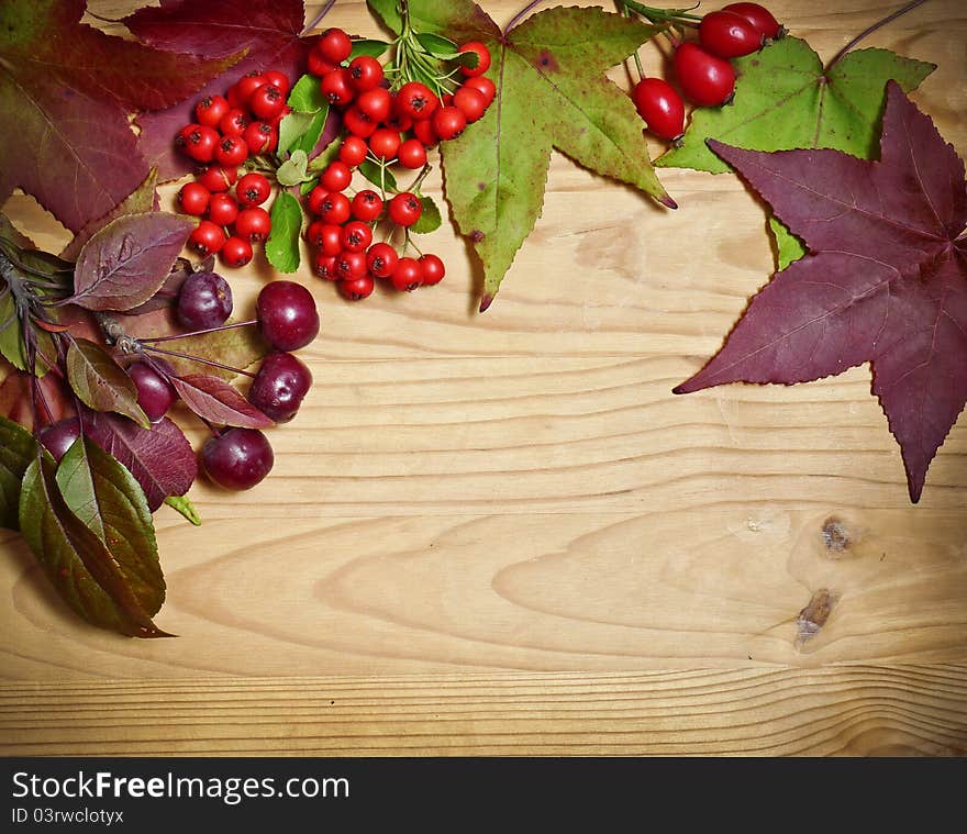 Autumn leaves decoration on wooden background