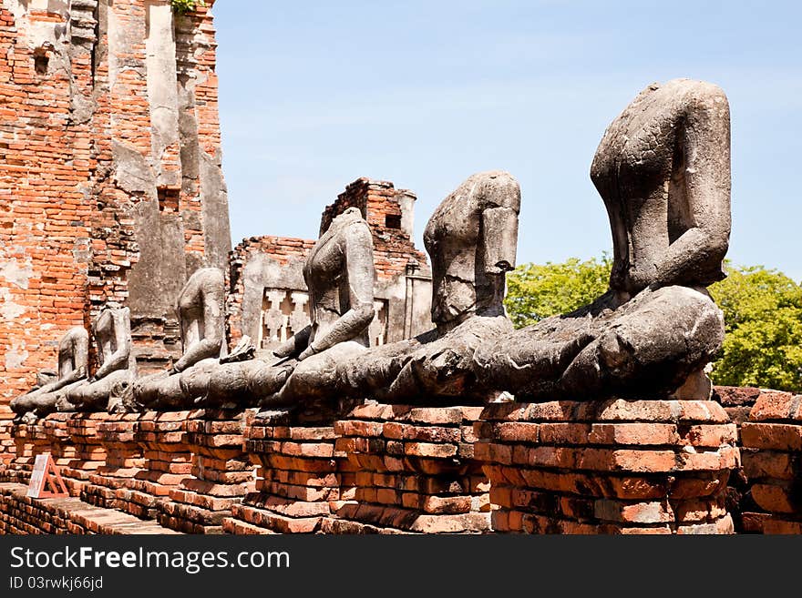 Row of headless buddha statue in wat chaiwattanaram, ayutthaya, thailand