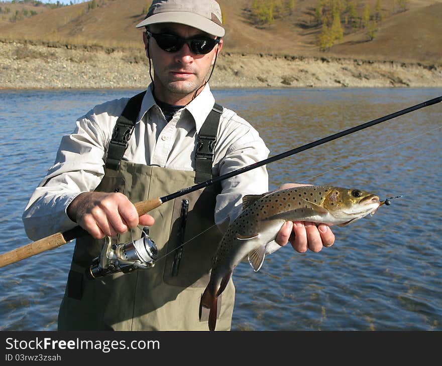 Fishing - fisherman catched big trout